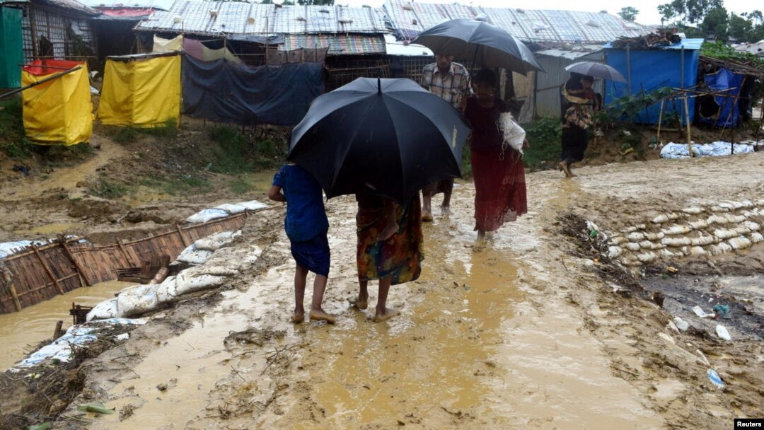FILE - People walk after a storm at Balukhali refugee camp in Cox's Bazar, Bangladesh, June 10, 2018, in this image obtained from social media. 