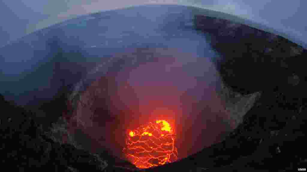 The summit of Kilauea lava lake in Hawaii has dropped significantly roughly 220 meters below the crater rim in this very wide angle camera view capturing the entire north portion of the Overlook crater, May 6, 2018.