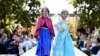 Young models wear two of 2014's hottest Halloween costumes, (from left) Anna and Elsa from Disney's "Frozen" at a Disney Halloween Fashion Show on Oct. 1, 2014, in Glendale, Calif.