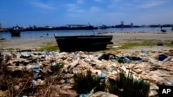 FILE: The shore of the Tunisian coastal town of Zarzis is pictured, Saturday June 12, 2021. Zarzis is a port city where migrants bound for Europe frequently wind up after their boats go astray in the Mediterranean's uncertain currents. 