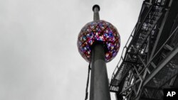 A test is performed in New York's Times Square Dec. 30, 2018, of the New Year's Eve ball that will be lit and sent up a 130-foot pole atop One Times Square to mark the start of the 2019 New Year.