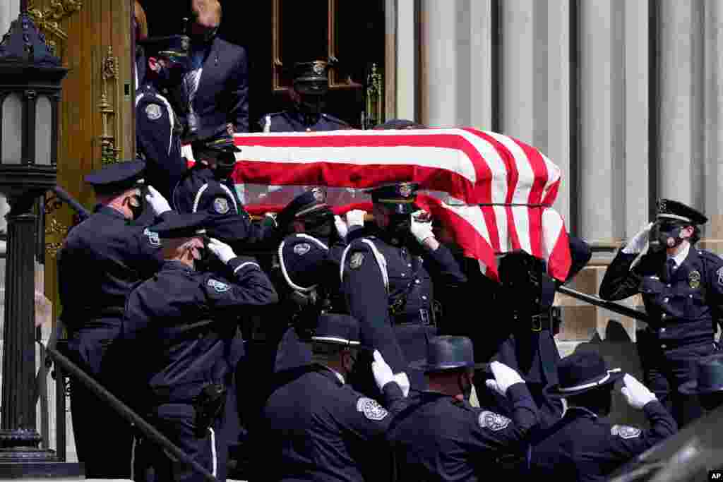 The casket carrying the body of fallen Boulder Police Department officer Eric Talley is carried by a Denver Police honor guard to a waiting hearse after a service at the Cathedral Basilica of the Immaculate Conception, March 29, 2021, in Denver, Colorado.