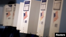 FILE -- Voting booths are ready for the New York primary elections at a polling station in the Brooklyn borough of New York City, U.S., April 19, 2016. U.S. voters go to the polls November 8 to elect a new president and members of Congress.