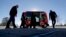 FILE - A driverless shuttle sits on display at the Riverside EpiCenter in Austell, Georgia, Jan. 26, 2017. 