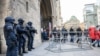 Policemen stand at the Stephansdom (St. Stephen's Cathedral) in Vienna, Austria, on December 24, 2023.