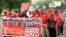 People march in a silent protest calling on the government to rescue the kidnapped girls of the government secondary school in Chibok, who were abducted a year ago, in Abuja, Nigeria, April 13, 2015.
