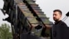 FILE - Ukrainian President Volodymyr Zelenskiy looks on during a visit to a military training area to find out about the training of Ukrainian soldiers on the U.S. Patriot anti-aircraft missile system, in Germany, June 11, 2024. 