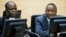 FILE - Kenya's President Uhuru Kenyatta (R) and a member of the Defense Council attend a hearing at the International Criminal Court in The Hague, Netherlands, Sept. 21, 2011.