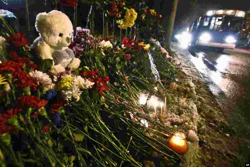 Flowers and toys are placed at the site of a trolleybus bombing in Volgograd, Russia, Dec. 31, 2013.