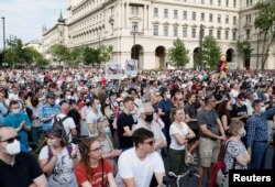 FILE - Demonstrators protest against the planned Chinese Fudan University campus in Budapest, Hungary, June 5, 2021.