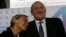 Frontrunner Giorgi Margvelashvili (R) is seen with his partner, Maka Chichua, at the Georgian Dream coalition's headquarters in Tbilisi, October 27, 2013.