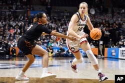 Dorka Juhasz could be making money if she still lived in Hungary. However, she is playing college basketball for the University of Connecticut. (AP Photo/Jessica Hill)