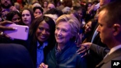 Democratic presidential candidate Hillary Clinton takes a photograph with a member of the audience after speaking at a Women for Hillary fundraiser at the Hyatt Regency in Washington, Oct. 5, 2016. Clinton's campiagn is now actively mobilizing the women's