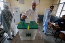 A Pakistani tribesman cast his vote during an election for provincial seats in Jamrud, a town of Khyber district, Pakistan, Saturday, July 20, 2019.