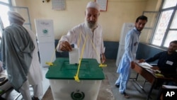 FILE - A Pakistani tribesman cast his vote during an election for provincial seats in Jamrud, a town of Khyber district, Pakistan, July 20, 2019. 