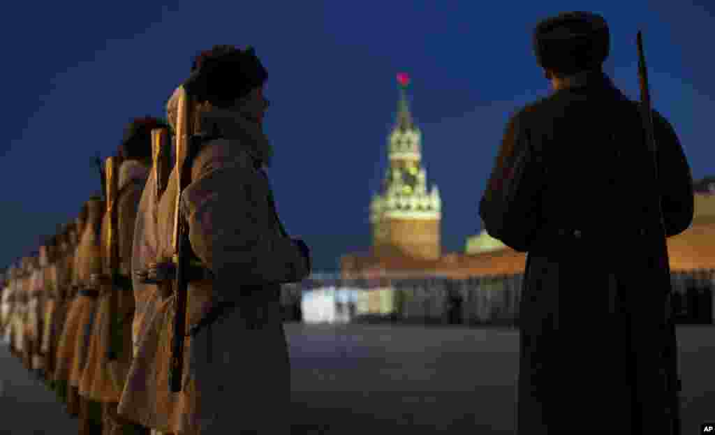 Russian soldiers dressed in Red Army World War II uniforms attend a rehearsal for the Nov. 7 parade in the Red Square with Spassky Tower in the background, in Moscow. The parade marks the 74th anniversary of a Nov. 7 parade on Red Square when soldiers went directly to the front during World War II. For decades Nov. 7 was a holiday celebrating the 1917 Bolshevik Revolution.