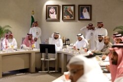 Saudi Health Minister Tawfiq Al-Rabiah, center left, meets with health officials to discuss the latest situation on coronavirus, at the Saudi Food and Drug Authority in Riyadh, Saudi Arabia, Feb. 27, 2020.