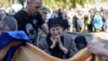 A mother cries near the coffin of her son killed by a Russian rocket attack at a Ukrainian military academy, during his funeral ceremony in Poltava, Ukraine, Sept. 7, 2024. 