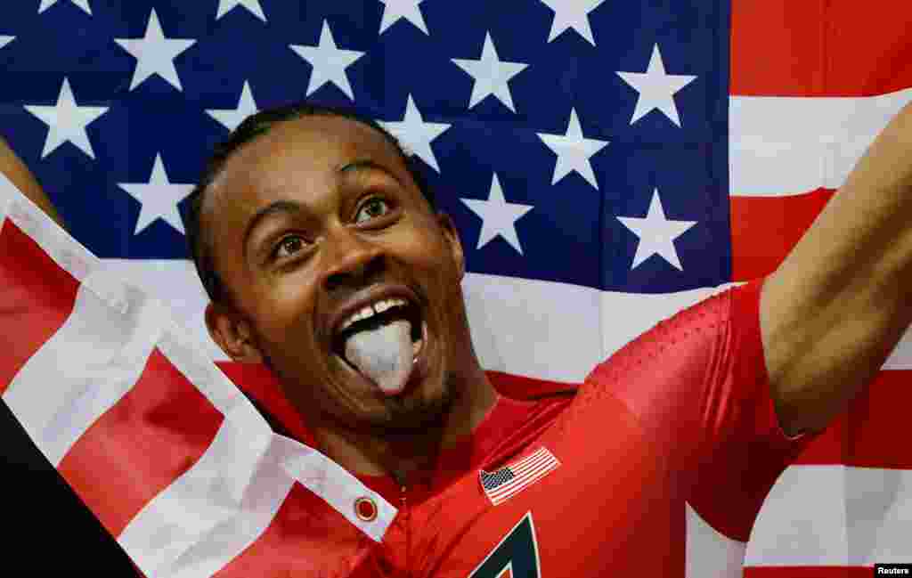 Aries Merritt of the U.S. celebrates after winning gold in the men's 110m hurdles final.