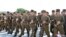 Soldiers gather to offer flowers to the statues of state founder Kim Il Sung and former leader Kim Jong Il on the Day of Songun at Mansu hill, Pyongyang, North Korea, in this undated photo released by North Korea's Korean Central News Agency, Aug. 26, 201