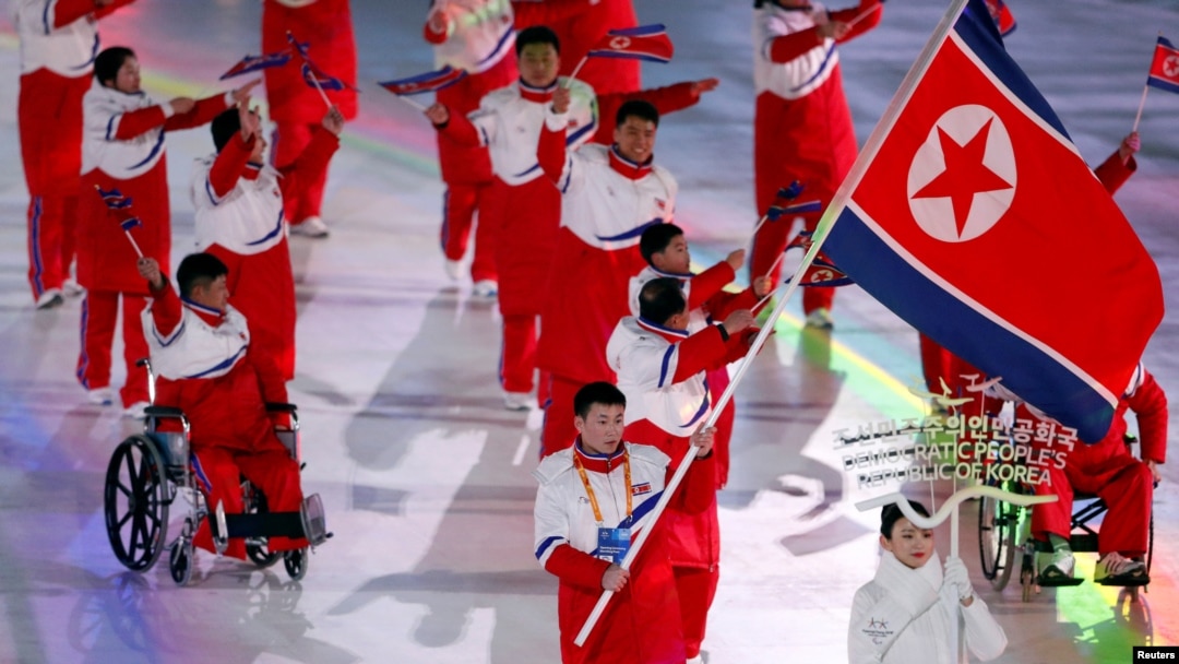 Jong Hyon Kim of North Korea carries the national flag during the opening ceremony, March 9, 2018, at the Pyeongchang 2018 Winter Paralympics in Pyeongchang, South Korea.