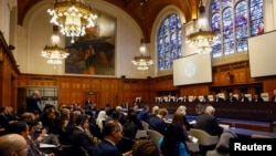 Delegates attend International Court of Justice public hearings in an advisory opinion case that may become a reference point in defining countries' legal obligations to fight climate change, in The Hague, Netherlands, Dec. 2 2024. 