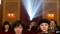 Left to right: Asa Butterfield plays Hugo Cabret and Chloë Grace Moretz plays Isabelle in HUGO, from Paramount Pictures and GK Films.