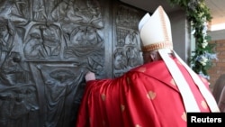 Pope Francis opens a Holy Door, one of only five that will be open during the 2025 Catholic Holy Year, at Rebibbia prison, in Rome, Dec. 26, 2024. (Photo by Vatican Media via Reuters)