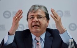 FILE - Colombia's Foreign Minister Carlos Holmes Trujillo gives a press conference during the 49th OAS General Assembly in Medellin, Colombia, June 26, 2019.