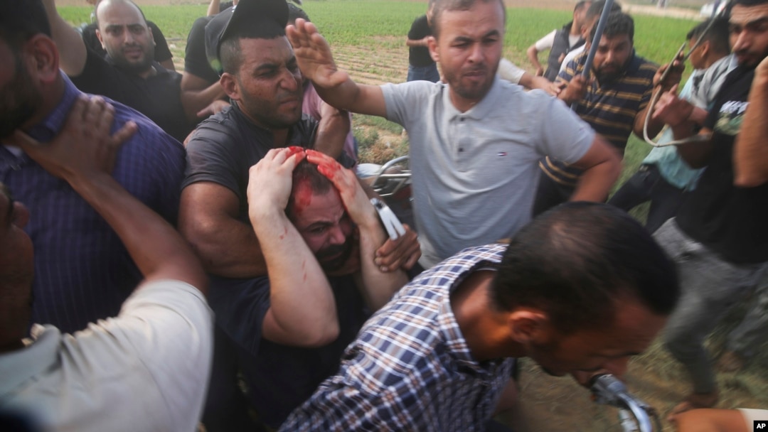 FILE - Palestinian Hamas militants transport Yarden Bibas to Gaza after kidnapping him from his home in Nir Oz, a kibbuz in Israel near the Gaza border, on Oct. 7, 2023.