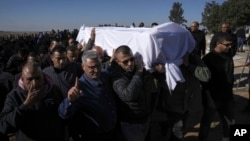 Members of the Bedouin community carry the body of Yosef Al Zaydani, who was in Hamas captivity in the Gaza Strip, a day after the Israeli army said his body was recovered in a tunnel in Gaza, during his funeral in Rahat, Israel, Jan. 9, 2025.