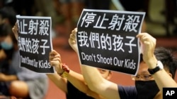 Residents of Tsuen Wan gather at an open air stadium, Oct. 2, 2019, to protest a teenage demonstrator shot at close range in the chest by a police officer in Hong Kong.