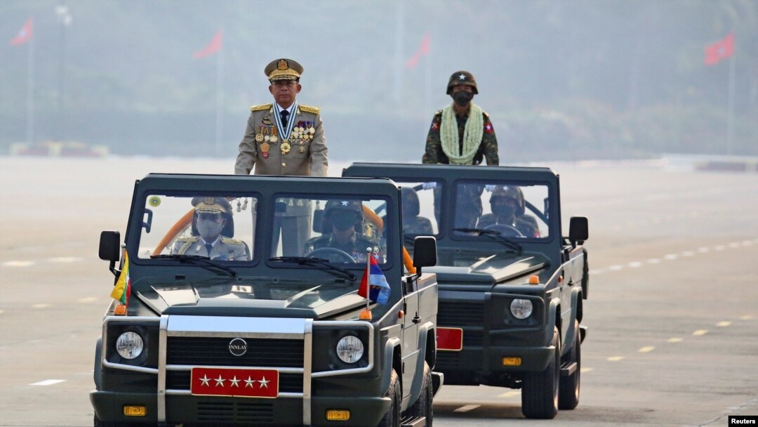 FILE - Myanmar's junta leader General Min Aung Hlaing, who ousted the country's elected government in a Feb. 1 coup, presides an army parade on Armed Forces Day in Naypyitaw, Myanmar, March 27, 2021.