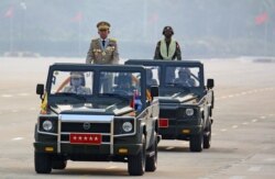 Myanmar's junta leader General Min Aung Hlaing, who ousted the country's elected government in a Feb. 1 coup, presides an army parade on Armed Forces Day in Naypyitaw, Myanmar, March 27, 2021.