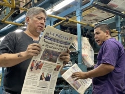 La Prensa press operators review back copies before receiving long-blocked supplies of ink, paper, in Managua, Nicaragua, Feb. 7, 2020.