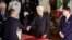 Foreign Minister Luigi Di Maio, left, shakes hands with Italian President Sergio Mattarella, center, as Prime Minister Giuseppe Conte looks on, during a swearing-in ceremony at the Quirinale Presidential Palace, in Rome, Italy, Sept. 5, 2019.