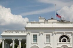 The American flag flies at half-staff at the White House in Washington, Aug. 4, 2019, to honor those killed in two mass shootings, one in Dayton, Ohio, and one in El Paso, Texas.