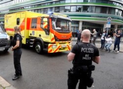 FILE - An ambulance which is believed to transport Alexei Navalny arrives at the Charite hospital in Berlin, Germany, Aug.22, 2020.