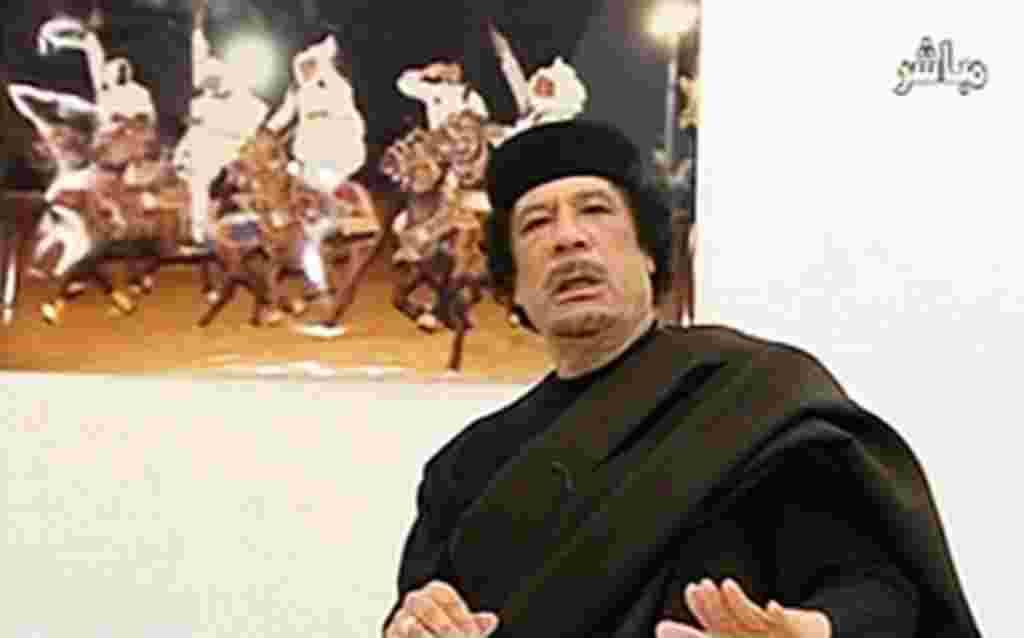 Libyan leader Moammar Gadhafi speaks during a live speech in this still image taken from video April 30, 2011