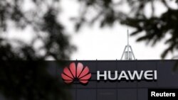 FILE - The Huawei logo is pictured outside its research facility in Ottawa, Ontario, Canada, Dec. 6, 2018.