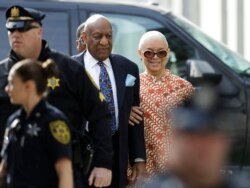 FILE - Bill Cosby arrives with his wife, Camille, right, for his sexual assault trial at the Montgomery County Courthouse in Norristown, Pennsylvania, April 24, 2018.