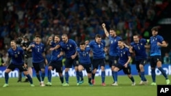 Italy players react during a penalty shootout after extra time during the Euro 2020 soccer championship final match between England and Italy, at Wembley stadium, London, July 11, 2021. 