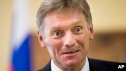 FILE - President Vladimir Putin’s spokesman Dmitry Peskov speaks to The Associated Press in Moscow.