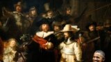 U.S. President Barack Obama smiles in front of Dutch master Rembrandt&#39;s The Night Watch painting during a visit to the Rijksmuseum in Amsterdam, Netherlands.