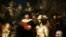 U.S. President Barack Obama smiles in front of Dutch master Rembrandt's The Night Watch painting during a visit to the Rijksmuseum in Amsterdam, Netherlands.