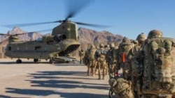 Soldiers attached to the 101st Resolute Support Sustainment Brigade, Iowa National Guard and 10th Mountain, 2-14 Infantry Battalion, load onto a Chinook helicopter to head out on a mission in Afghanistan, Jan.15, 2019.