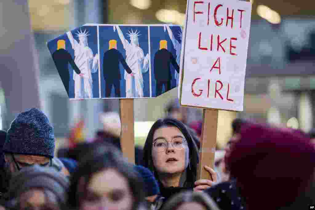 People protest in solidarity with the Women's March in Washington at the same time as the U.S. Presidential inauguration, in Brussels on Jan. 20, 2017. 