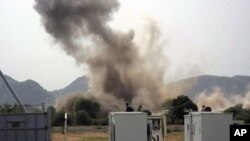 A huge explosion is seen near a United Nations compound in South Kordofan state, June 14, 2011.