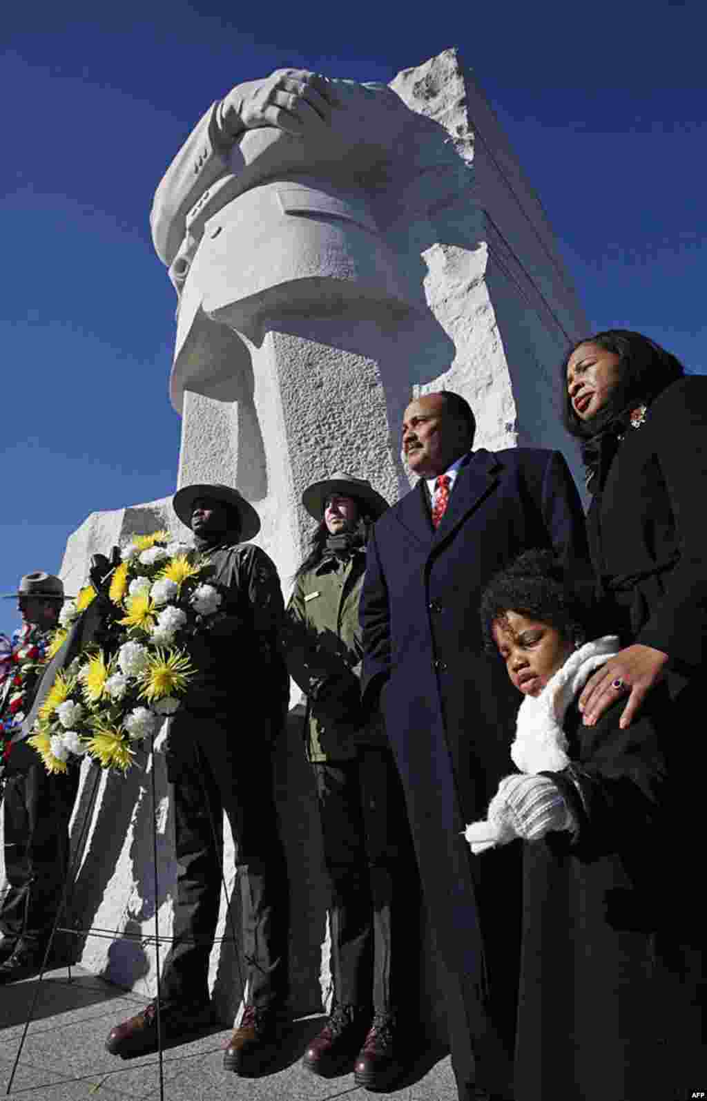 Martin Luther King III, center, the son of civil rights leader Martin Luther King Jr., at a wreath laying ceremony at the Martin Luther King, Jr. Memorial, in Washington, in observance of King's 83rd birthday anniversary, January 15, 2012. (AP)