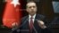 Turkey's Prime Minister Tayyip Erdogan addresses members of parliament from his ruling AK Party (AKP) during a meeting at the Turkish parliament in Ankara, June 18, 2013. 